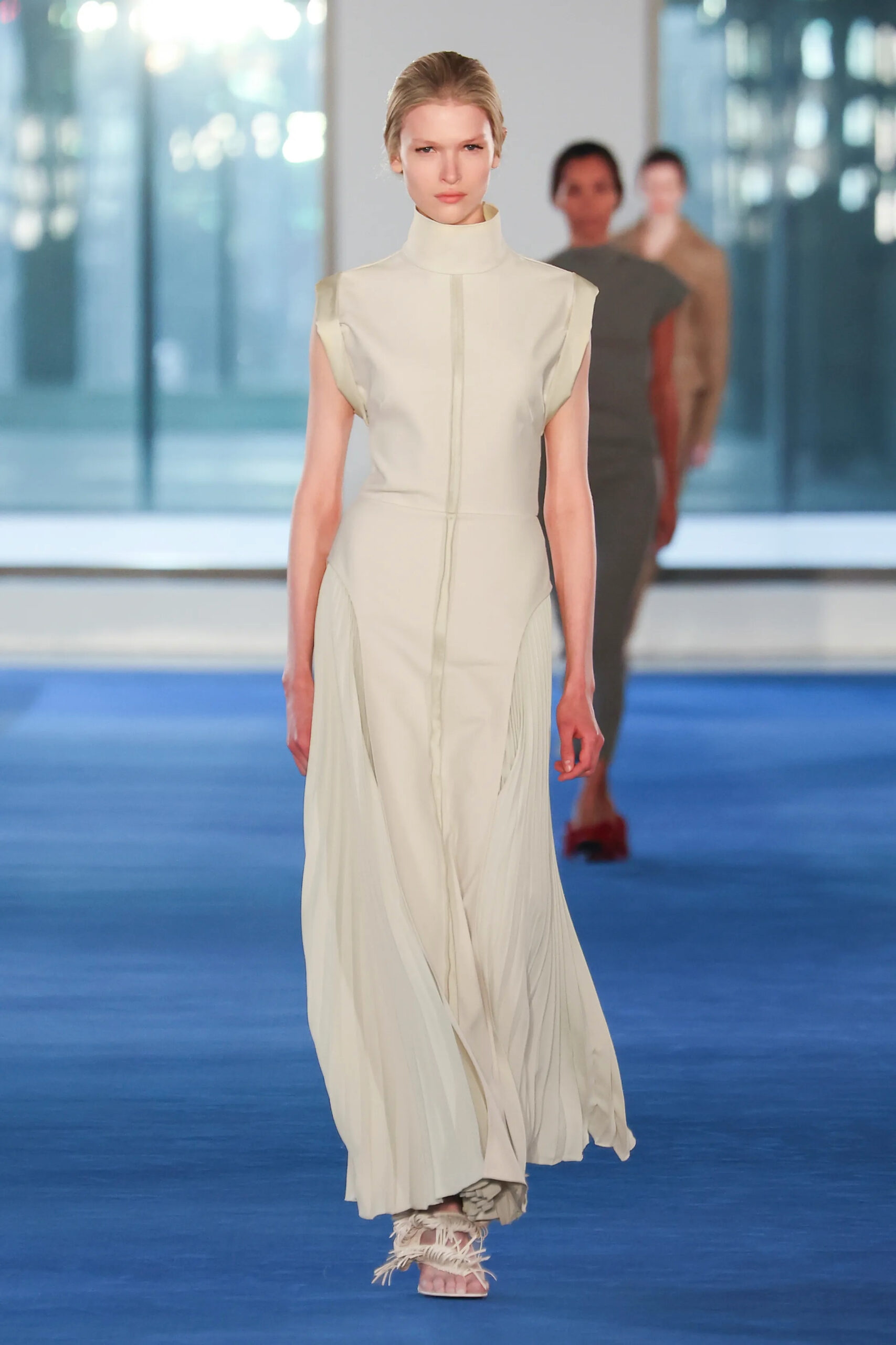 Cream pleated dress with sculptural neckline from Proenza Schouler Fall 2026 runway