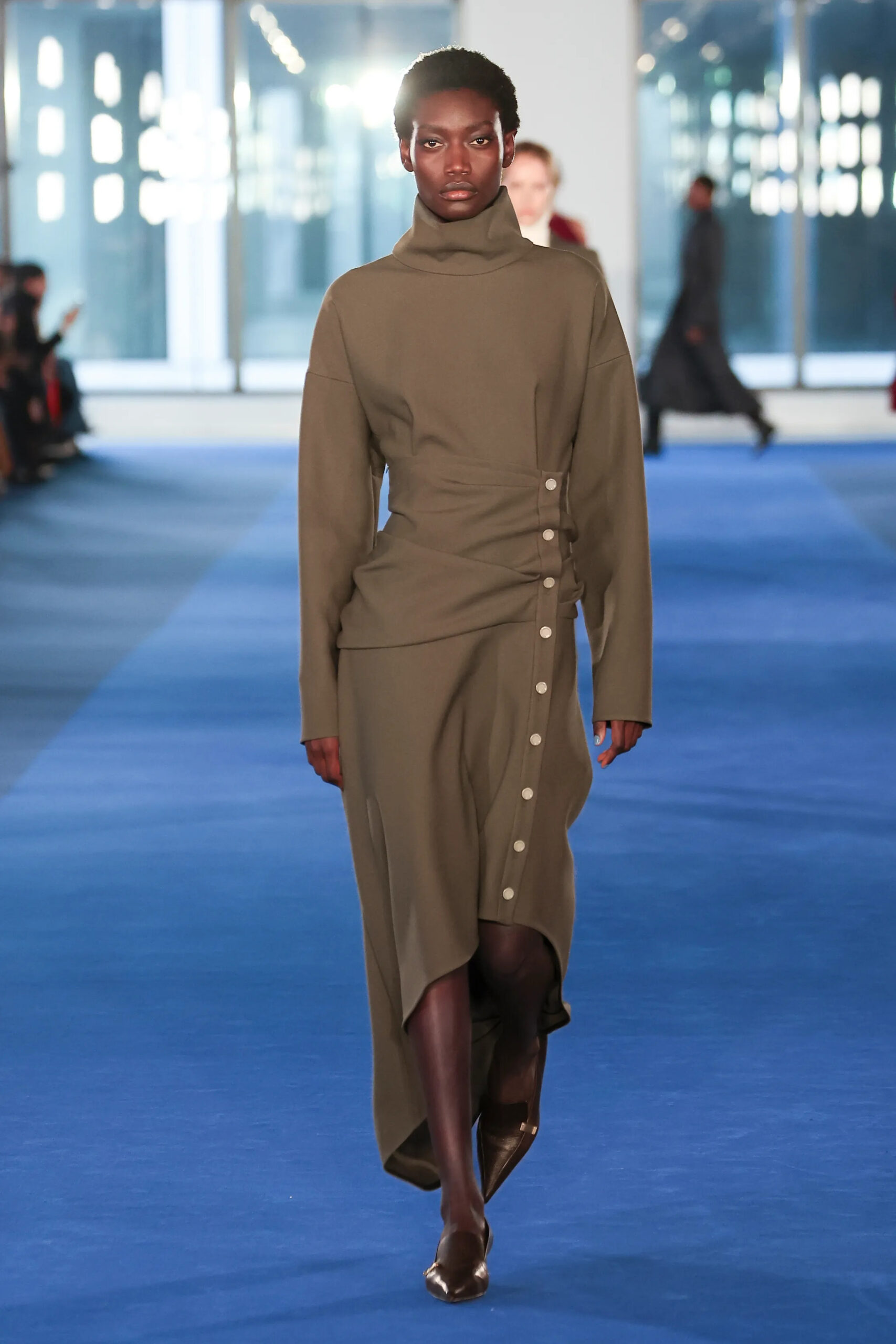Olive asymmetrical draped dress from Proenza Schouler Fall 2026 runway collection