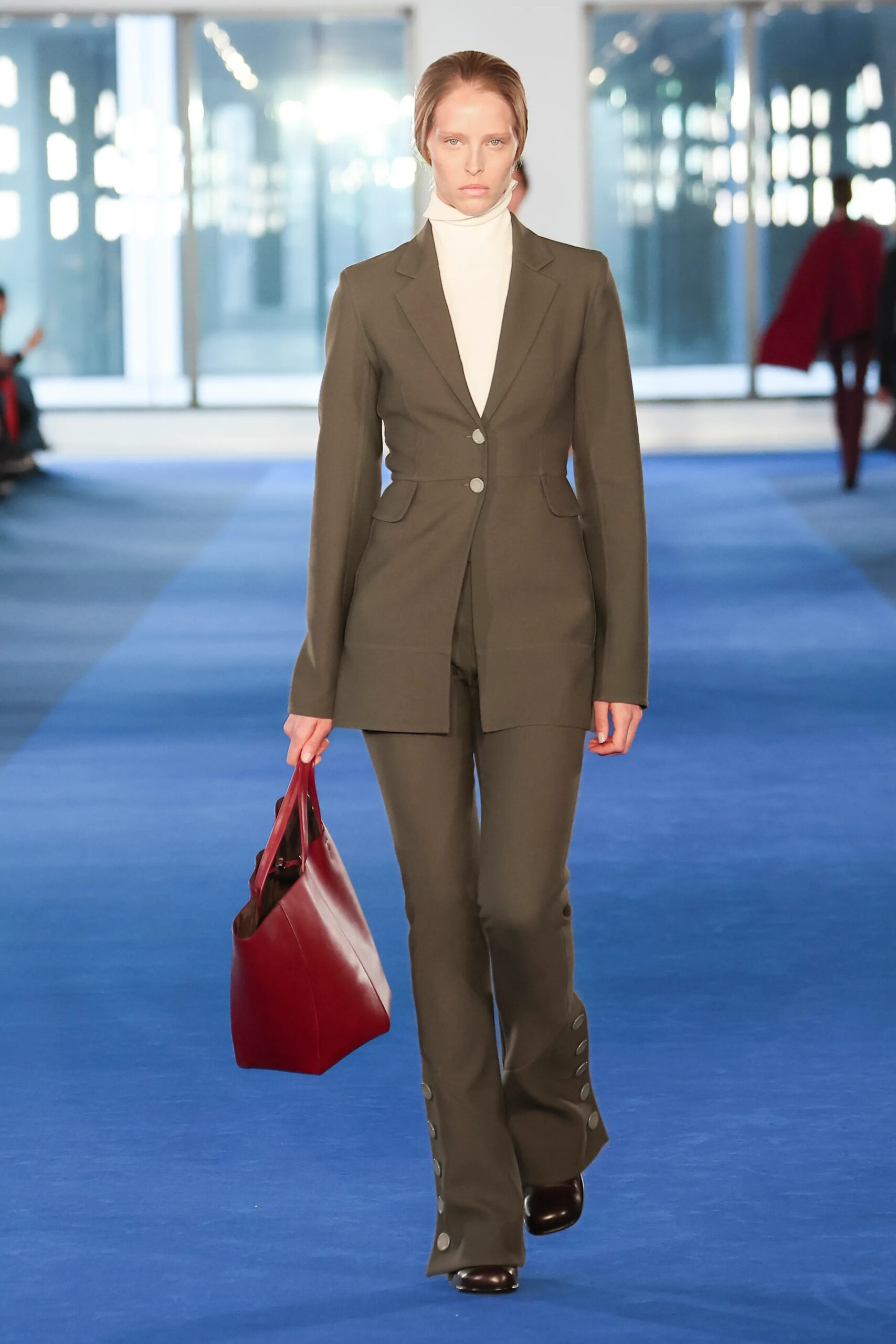 Olive tailored suit with burgundy leather tote from Proenza Schouler Fall 2026 runway