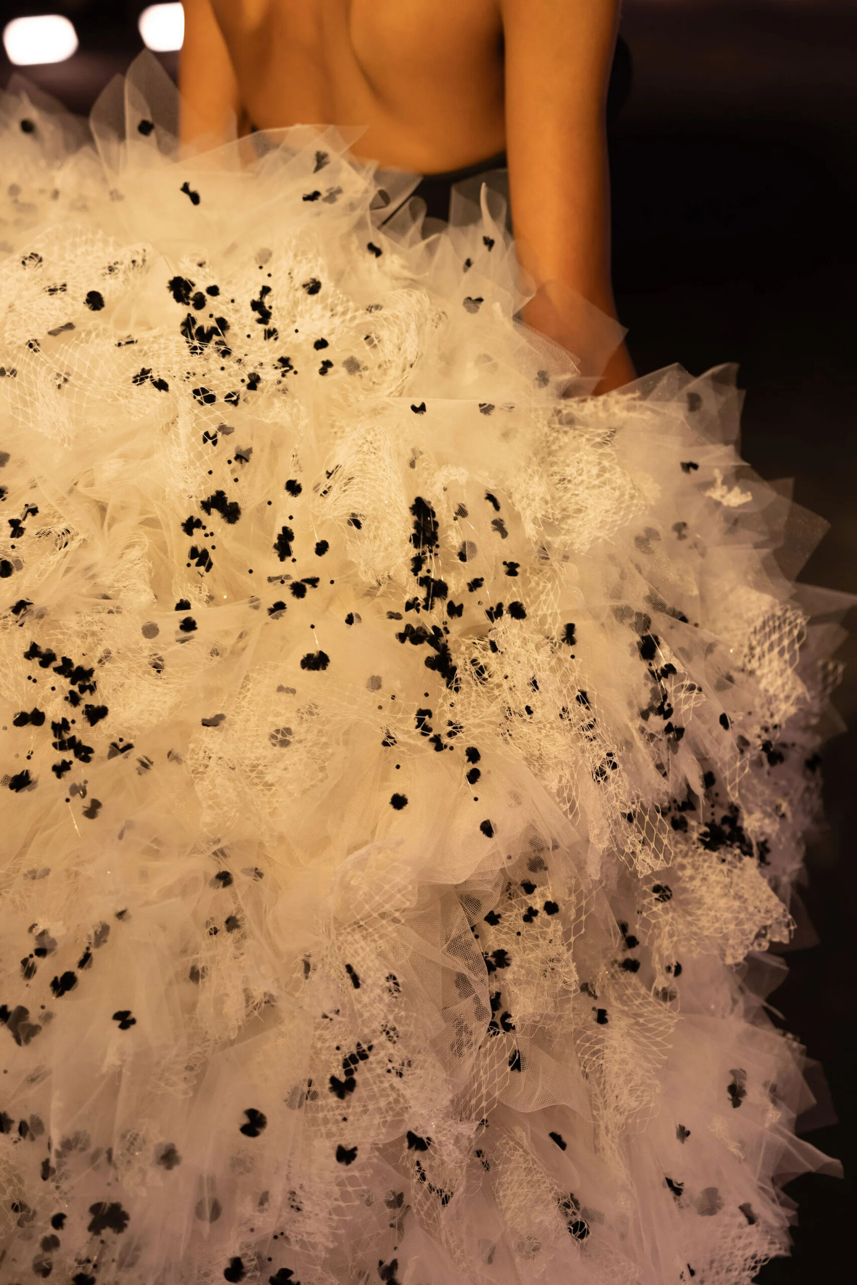 Close-up detail of ivory textured tulle on Schiaparelli couture gown