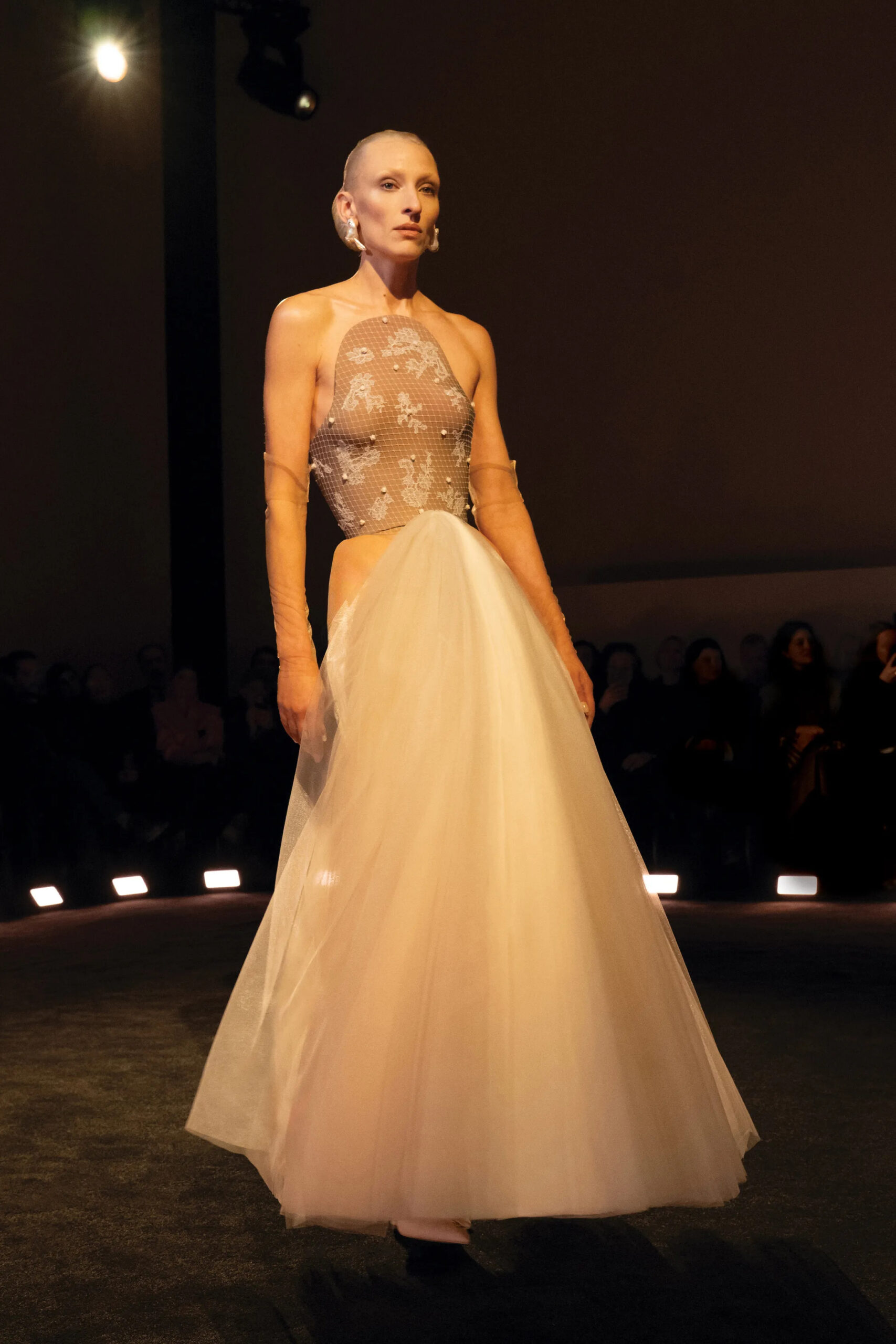 Ivory Schiaparelli couture gown with transparent bodice and soft tulle skirt