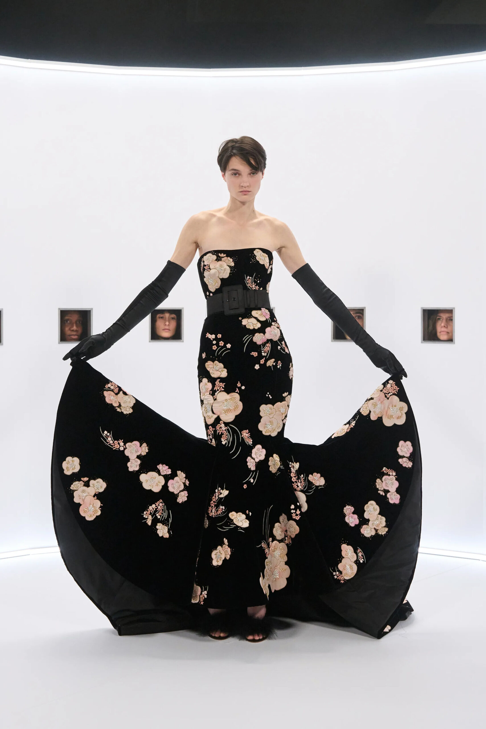 Black embroidered Valentino Spring 2026 Couture gown with dramatic side panels and opera gloves by Alessandro Michele