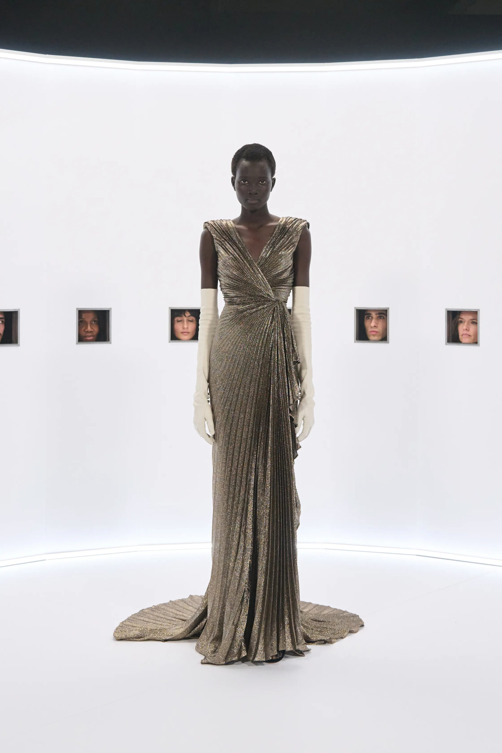 Gold draped Valentino couture gown with ivory opera gloves Spring 2026