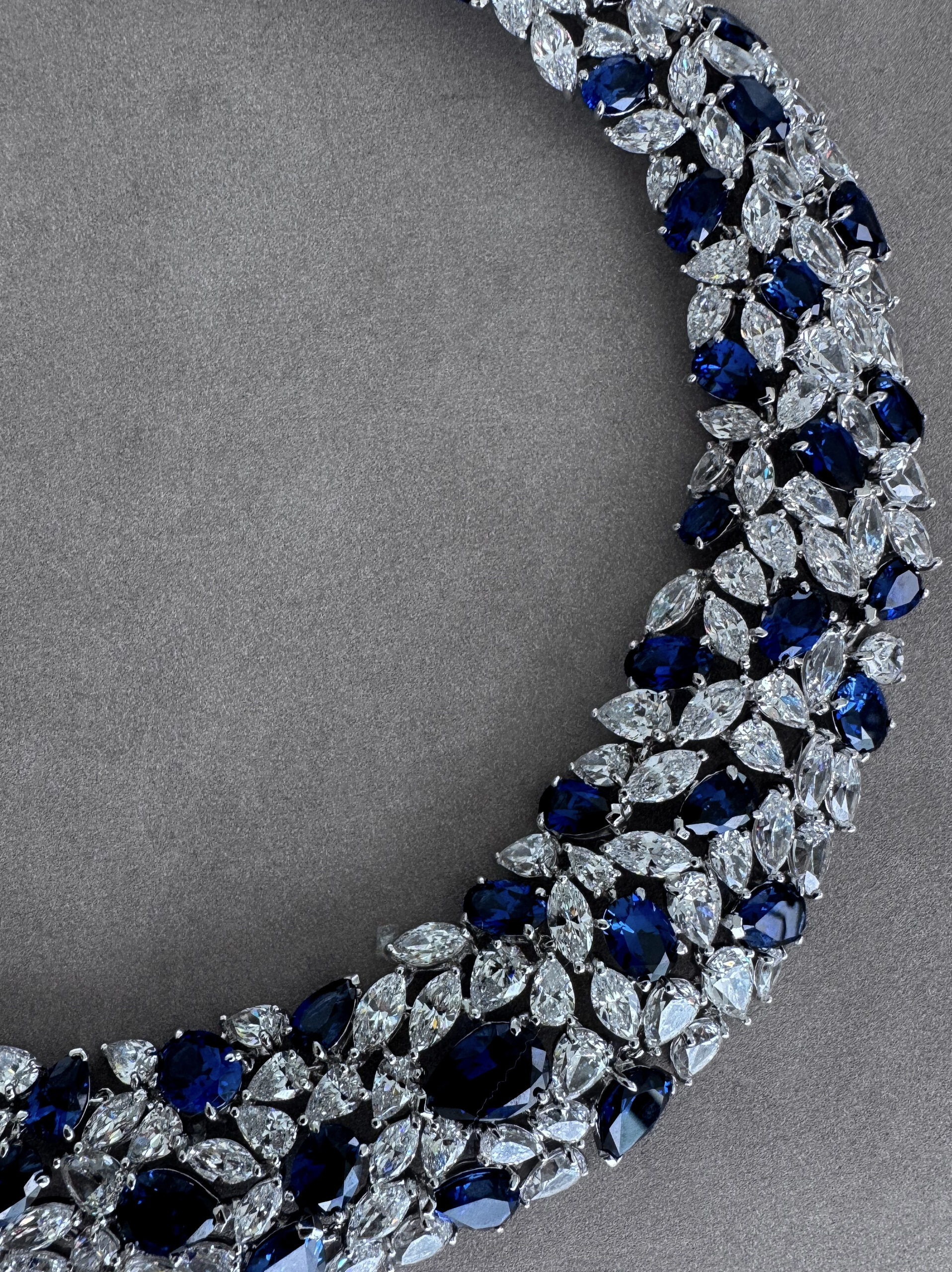 Close-up detail of sapphire and diamond choker jewelry designed by Victoria Barbara