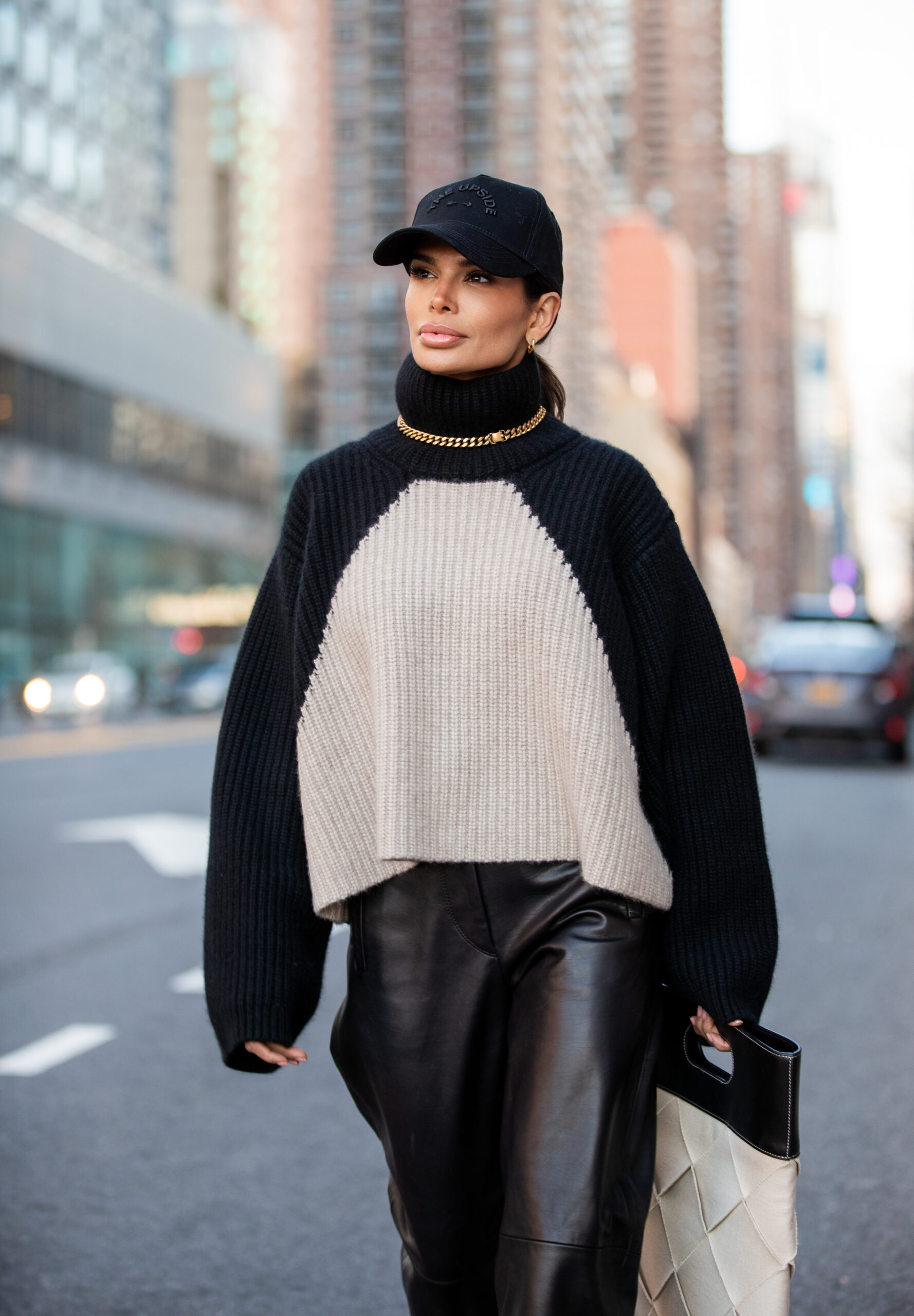 Portrait of Victoria Barbara wearing a KHAITE oversized sweater and Dior necklace in New York.