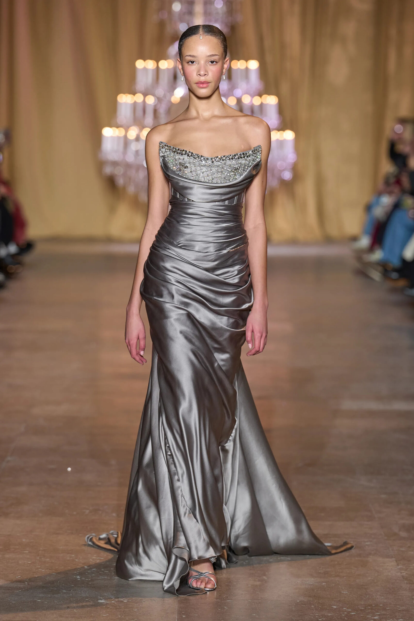 Model walking in a gunmetal satin Zuhair Murad Spring 2026 Couture gown with crystal detailing