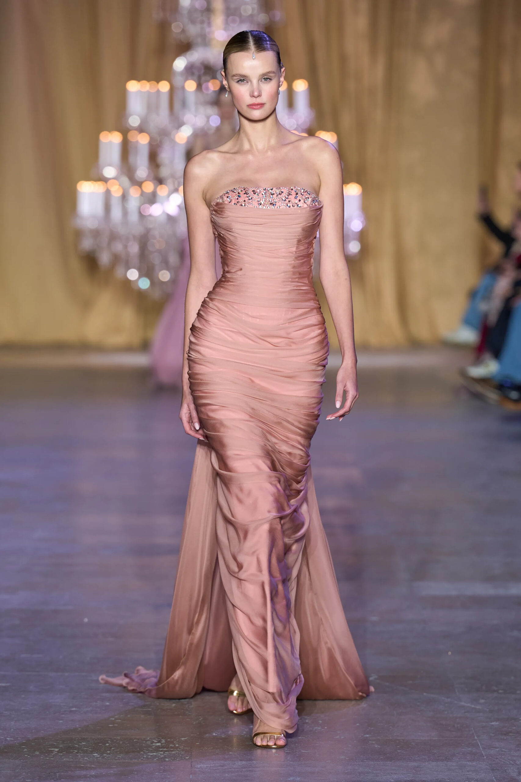 Model wearing a blush draped Zuhair Murad Spring 2026 Couture gown with crystal neckline embellishment
