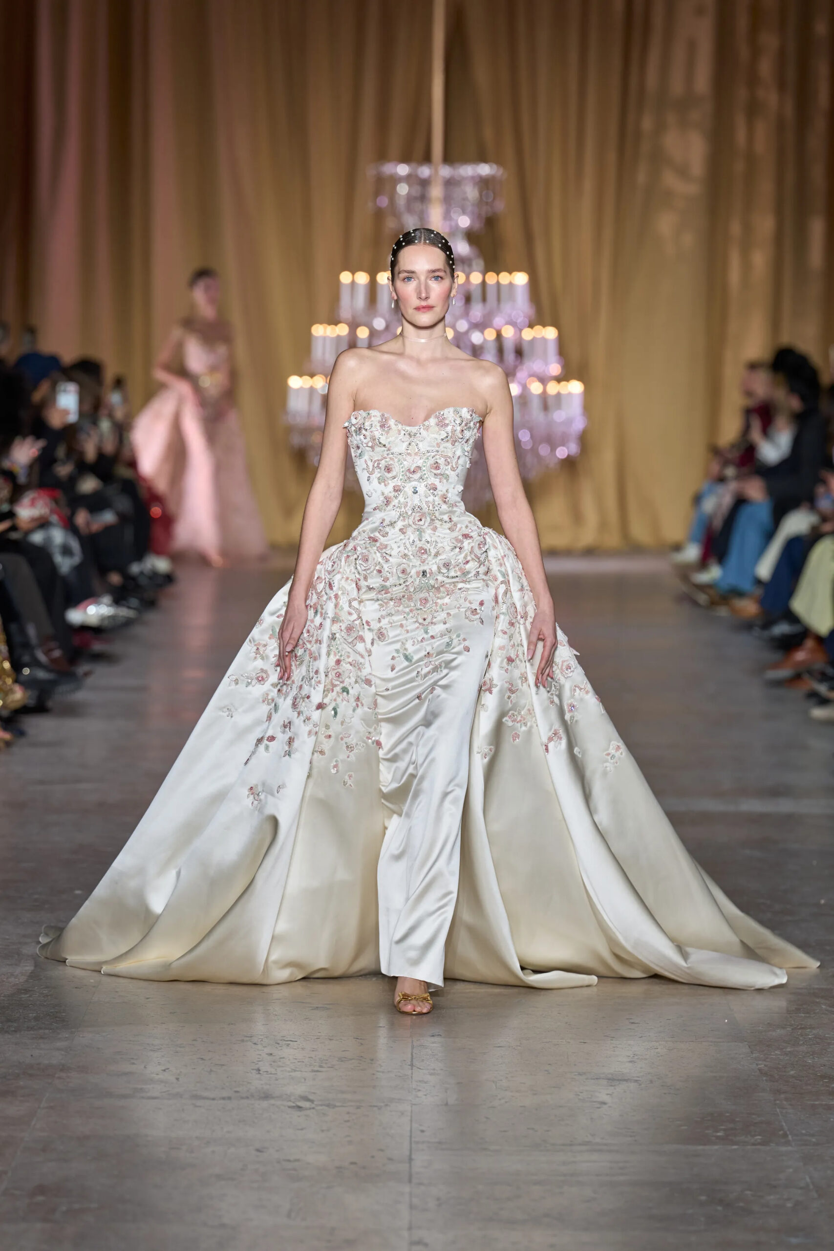 Model walking in Zuhair Murad Spring 2026 Couture finale gown featuring floral embroidery and sculpted overskirt