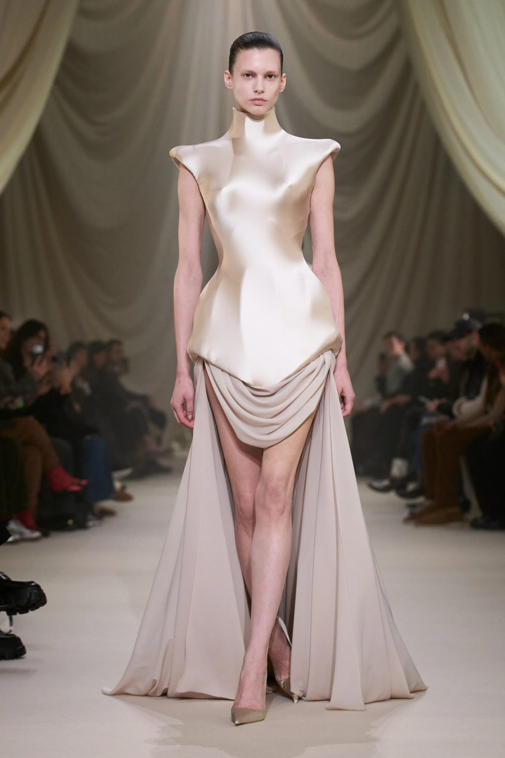 Ashi Studio Spring 2026 Couture sculptural ivory satin gown featuring an architectural neckline and draped skirt.