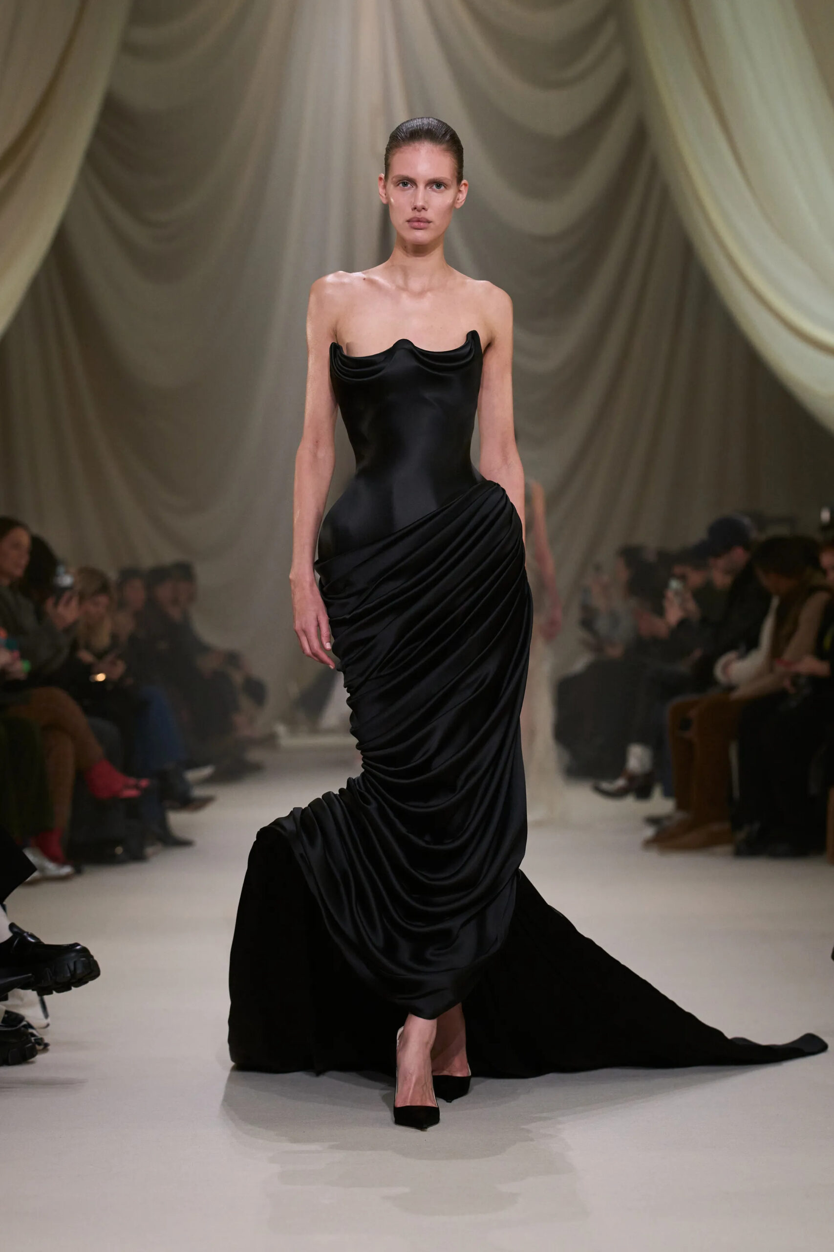 Ashi Studio Spring 2026 Couture black satin draped gown featuring sculptural corsetry and sweeping train.