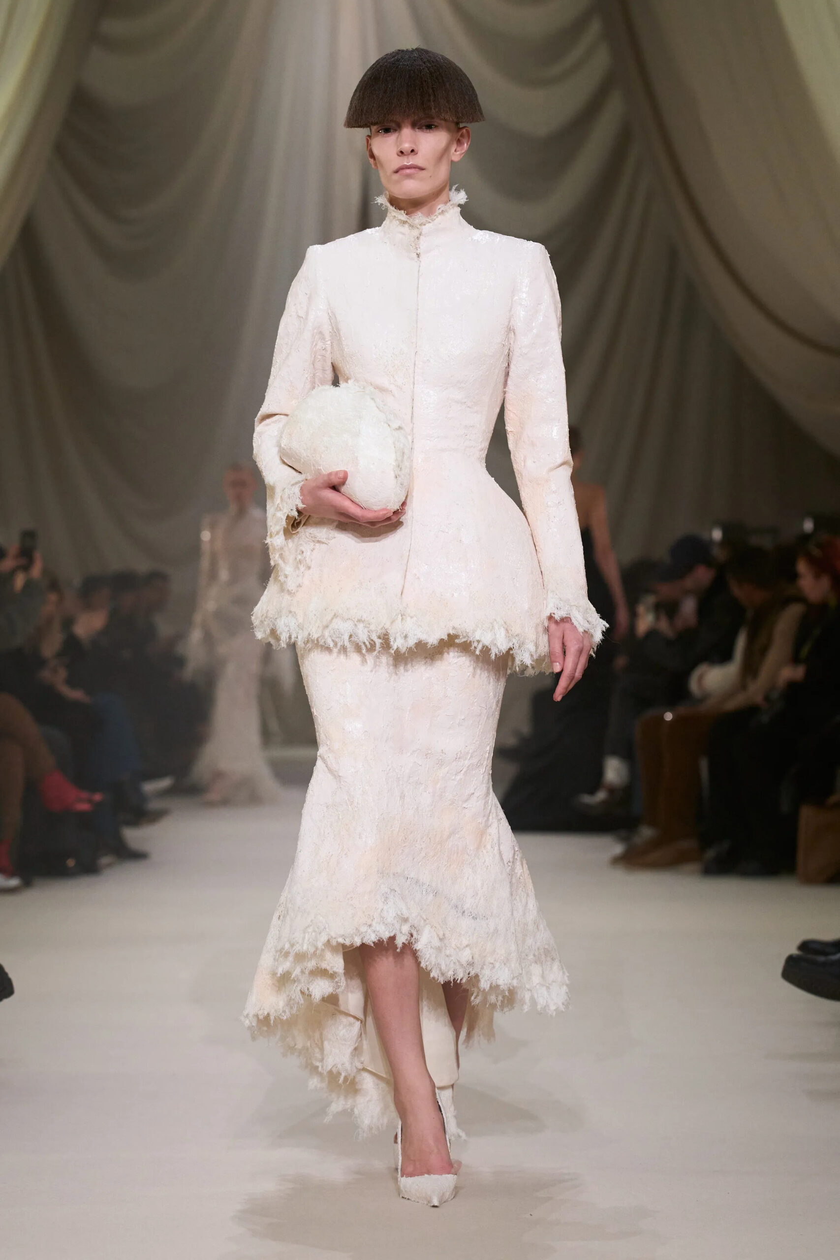 Ashi Studio Spring 2026 Couture ivory textured skirt suit paired with matching feathered clutch.
