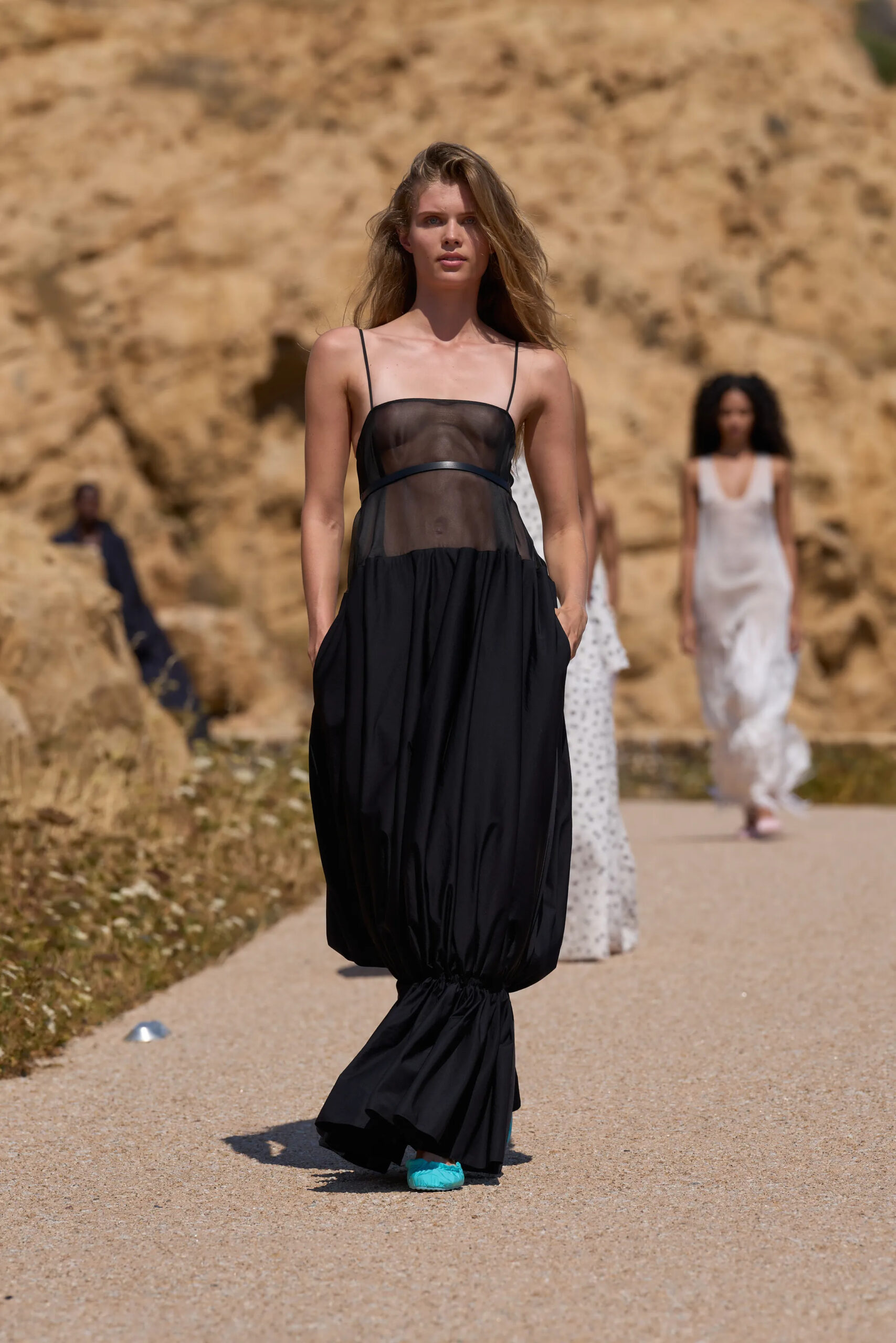 Jacquemus Spring Summer 2027 sheer black sleeveless dress with sculptural gathered skirt.