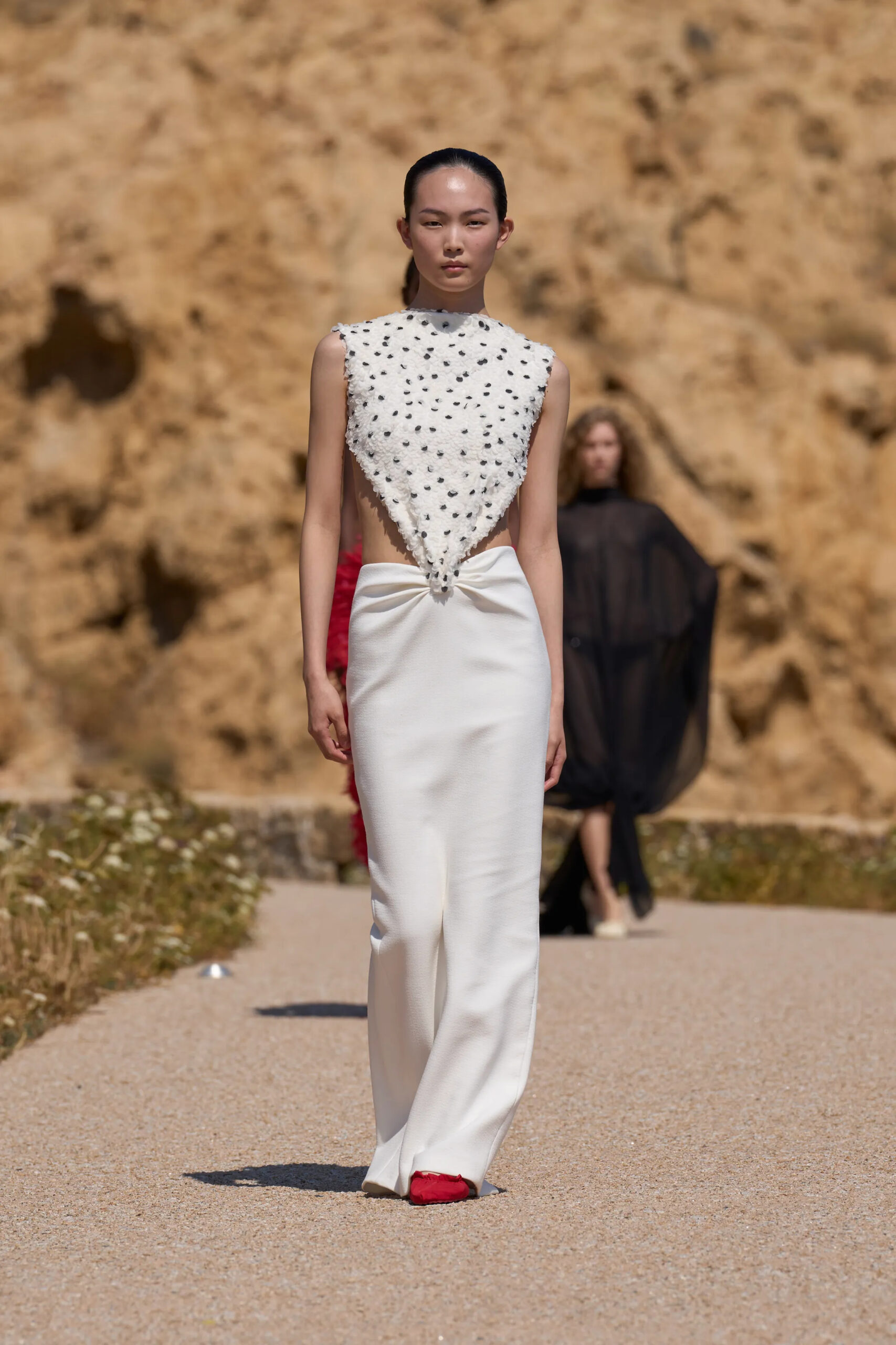 Jacquemus Spring Summer 2027 ivory embellished sleeveless top with white sculptural skirt.