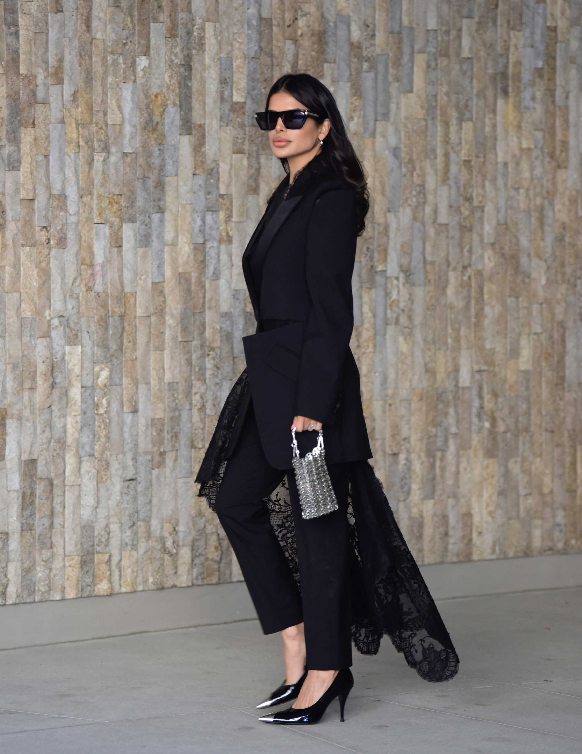 Victoria Barbara wearing Givenchy sunglasses with an Alexander McQueen blazer and trousers in a Los Angeles style editorial.