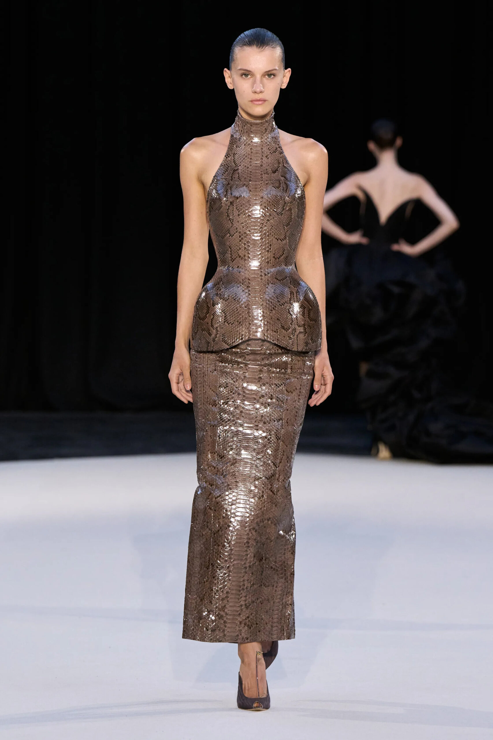 Model wearing a bronze reptile-effect sculpted couture column dress from Ashi Studio Fall 2026 Couture