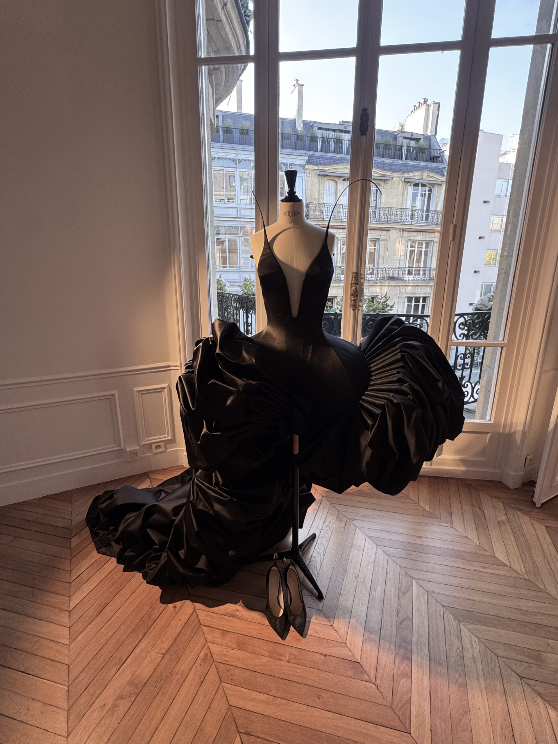 Black sculptural Ashi Studio couture gown displayed during the Fall/Winter 2026–2027 presentation in Paris