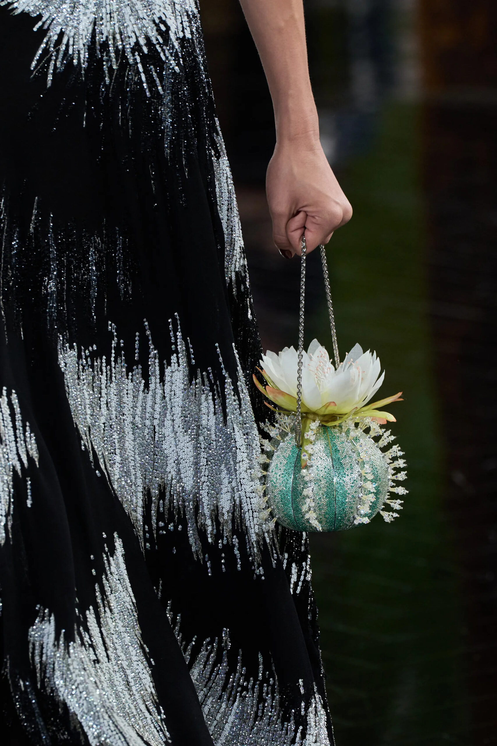 Dior couture minaudière featuring lily-inspired floral craftsmanship and crystal embellishment