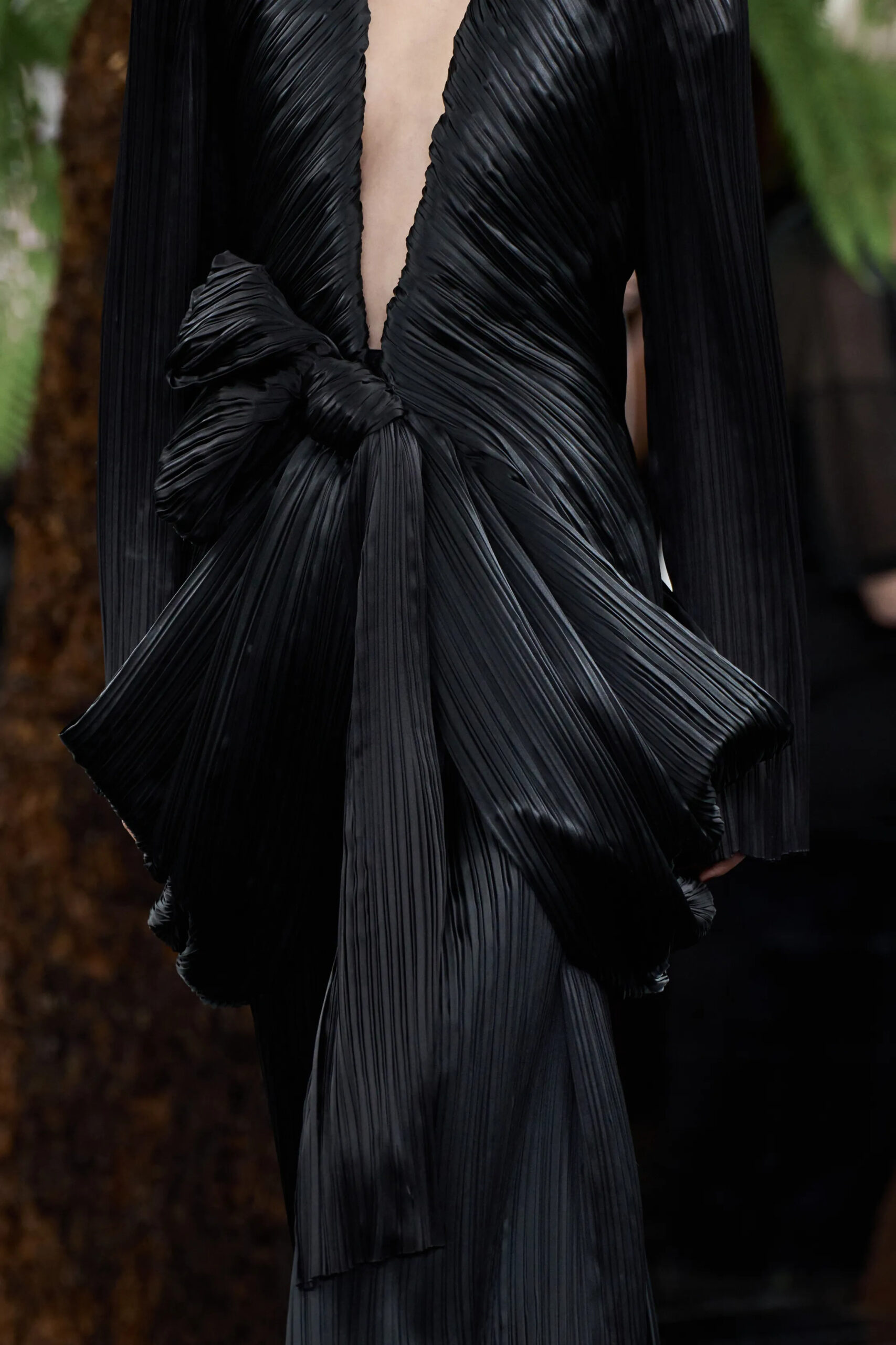 Close-up detail of an oversized black pleated bow from the Dior Fall 2026 Couture collection