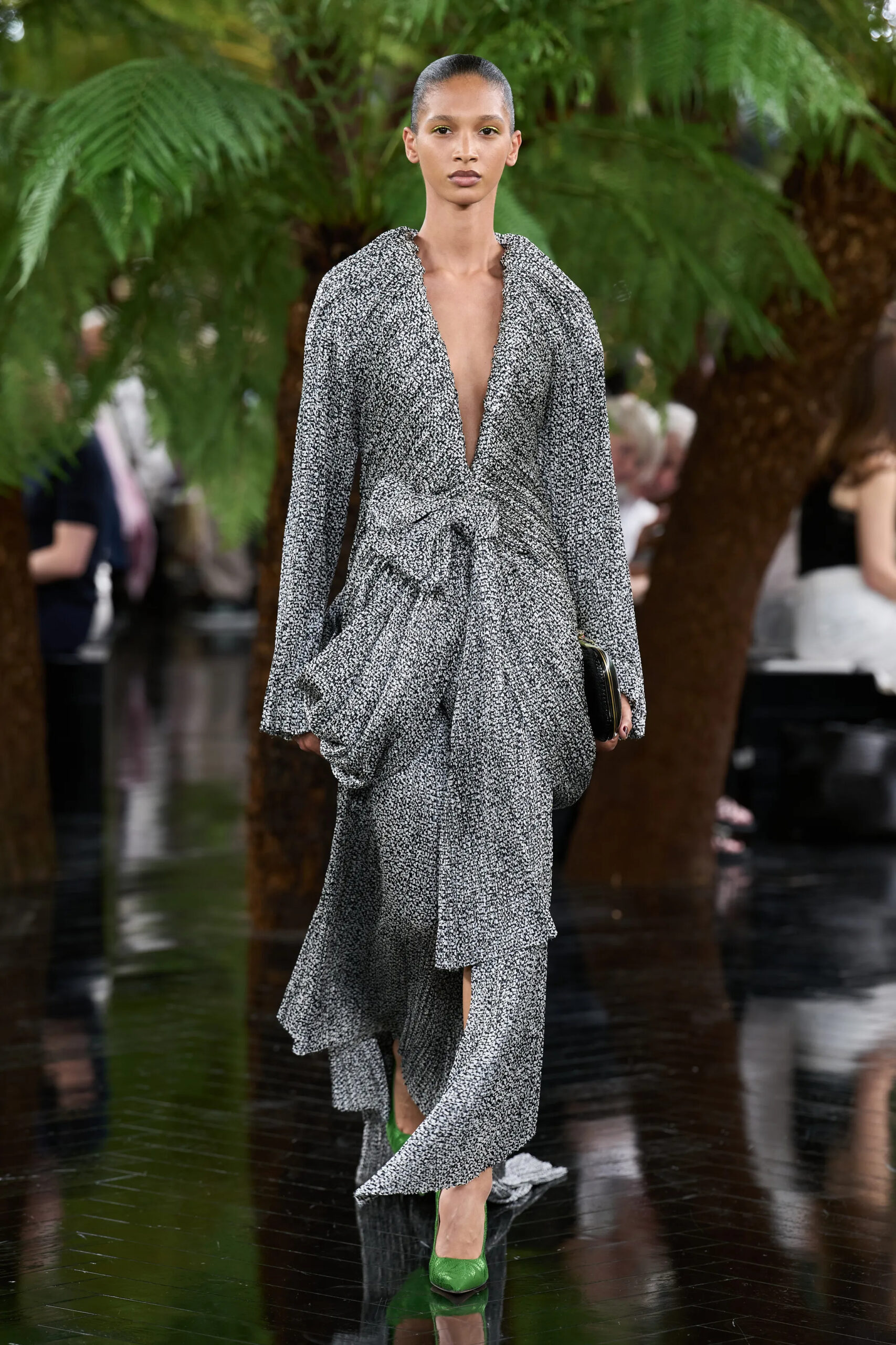 Model wearing a softly draped silver textured Dior Fall 2026 Couture look paired with green floral pumps