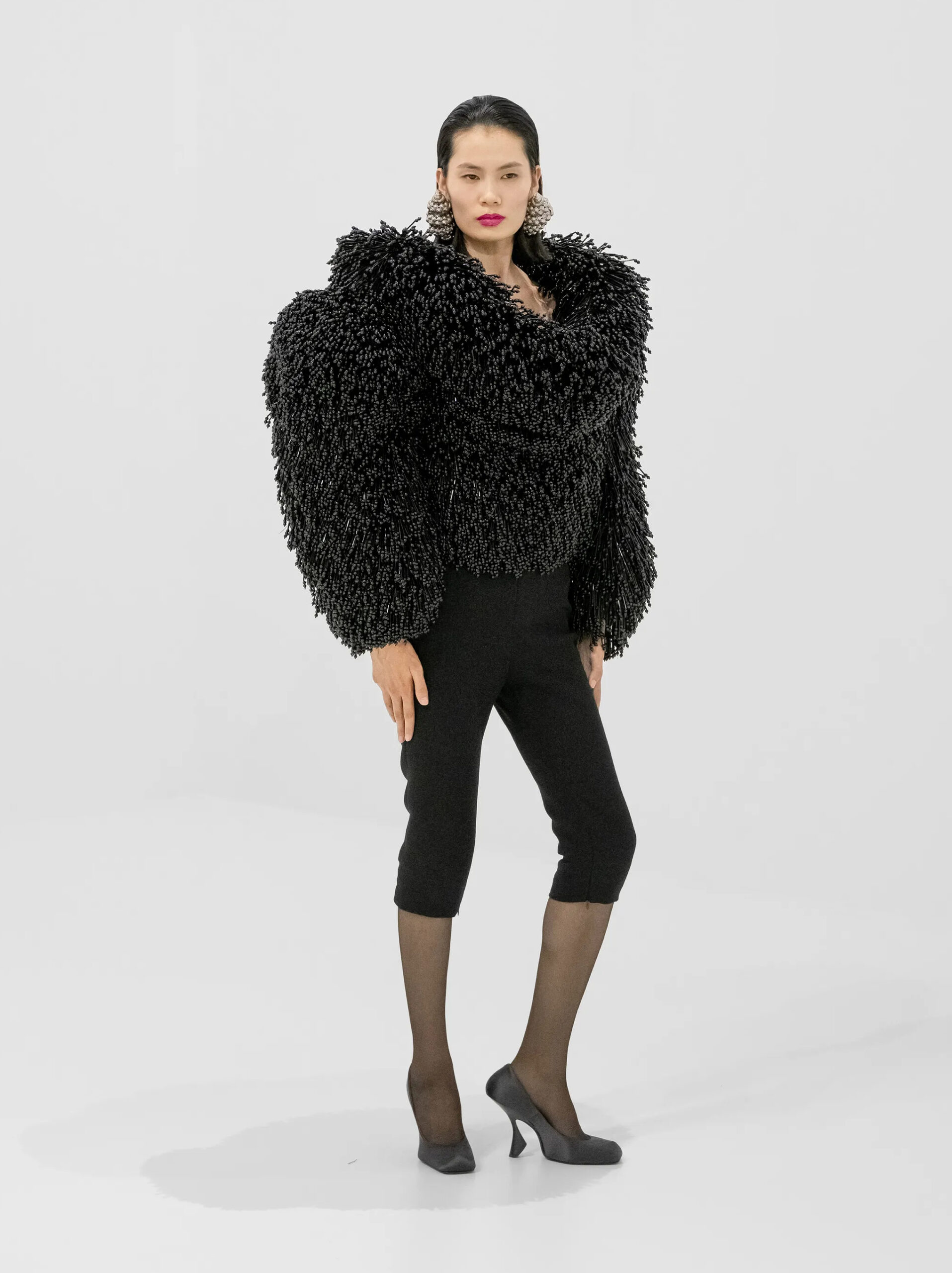 Black sculptural textured jacket with cropped trousers from Jean Paul Gaultier Fall 2026 Couture