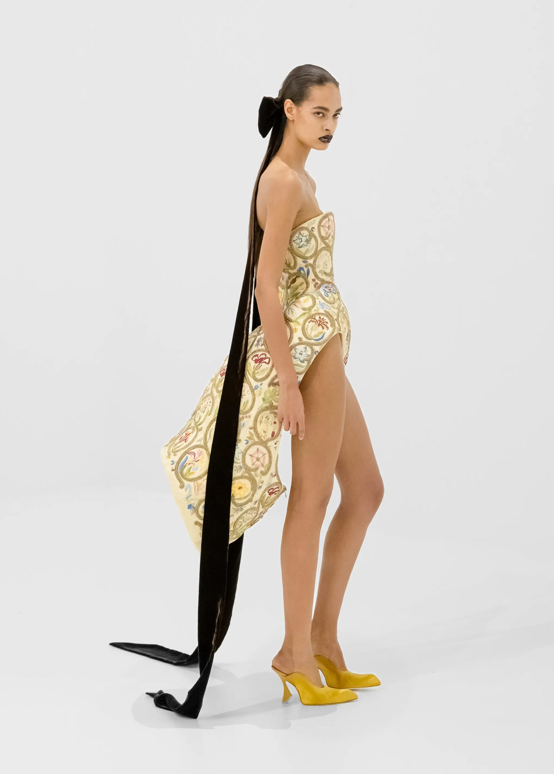 Embroidered corset couture look with yellow pumps from Jean Paul Gaultier Fall 2026 Couture