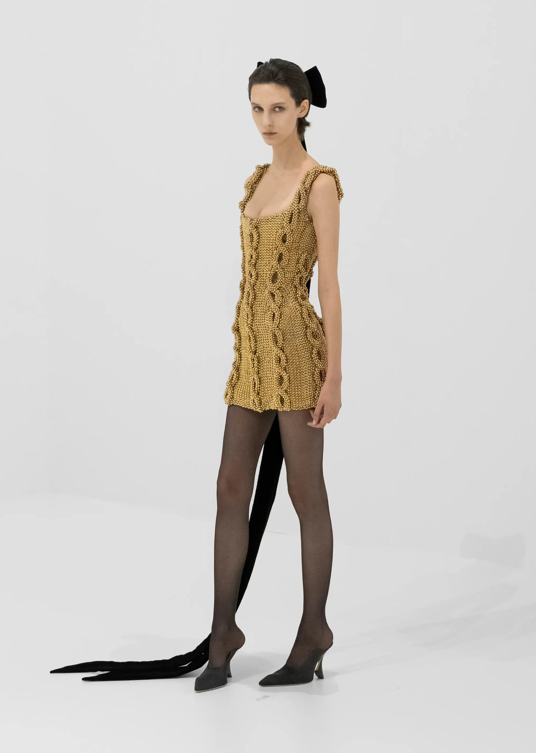 Metallic woven couture dress with shell-inspired headpiece from Jean Paul Gaultier Fall 2026 Couture