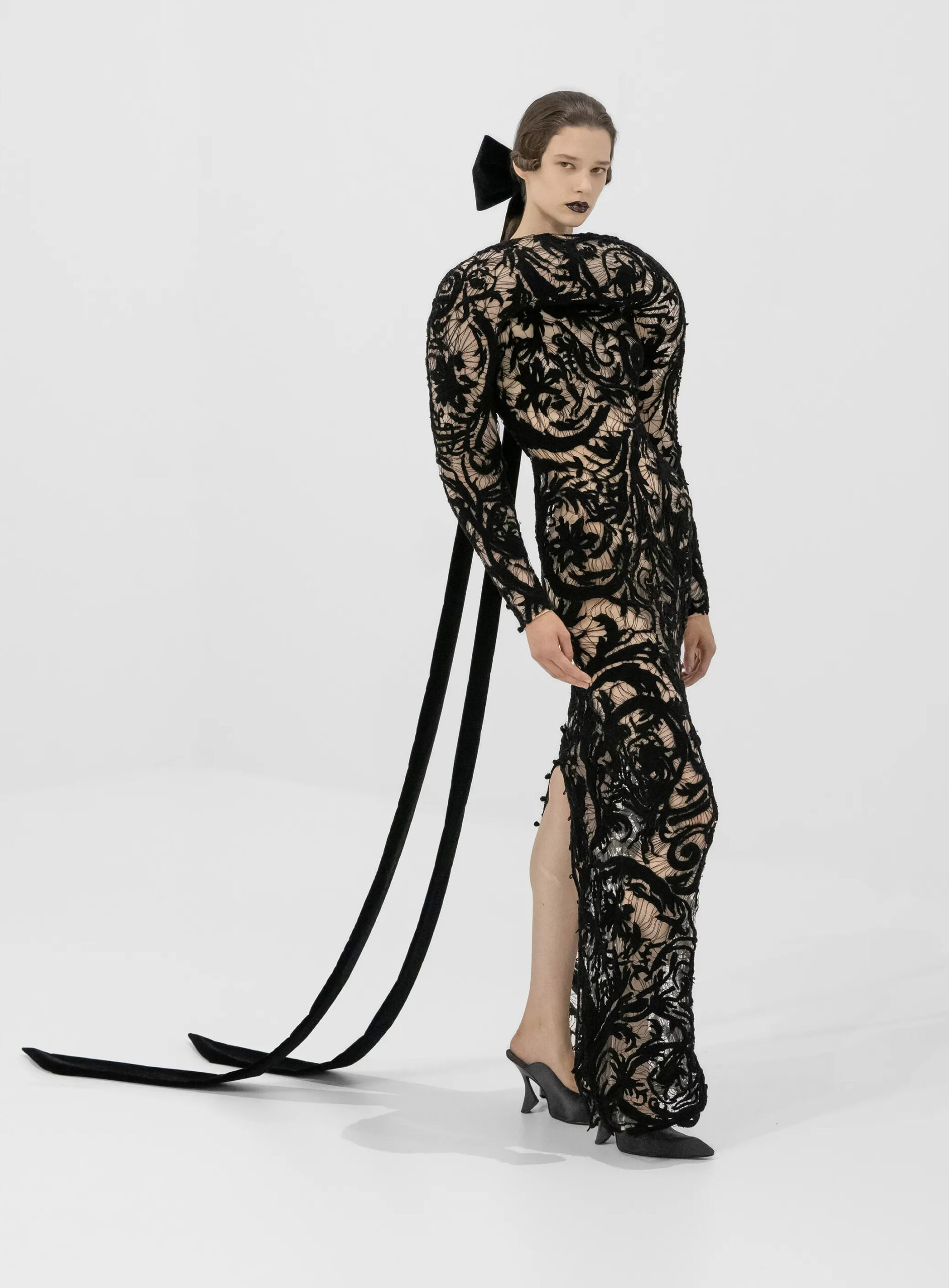 Black lace evening gown with dramatic velvet bow from Jean Paul Gaultier Fall 2026 Couture