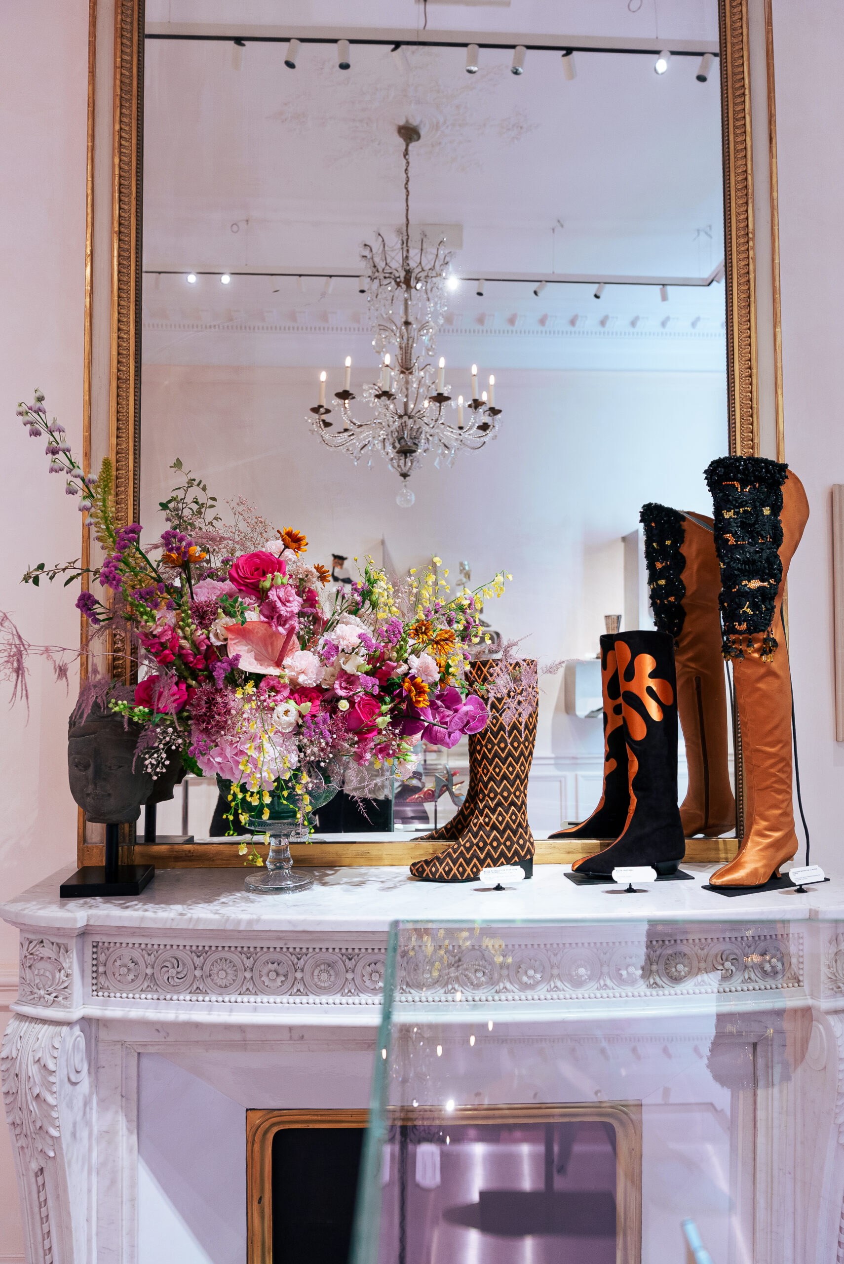 Roger Vivier floral installation with statement boots during L’Atelier des Papillons