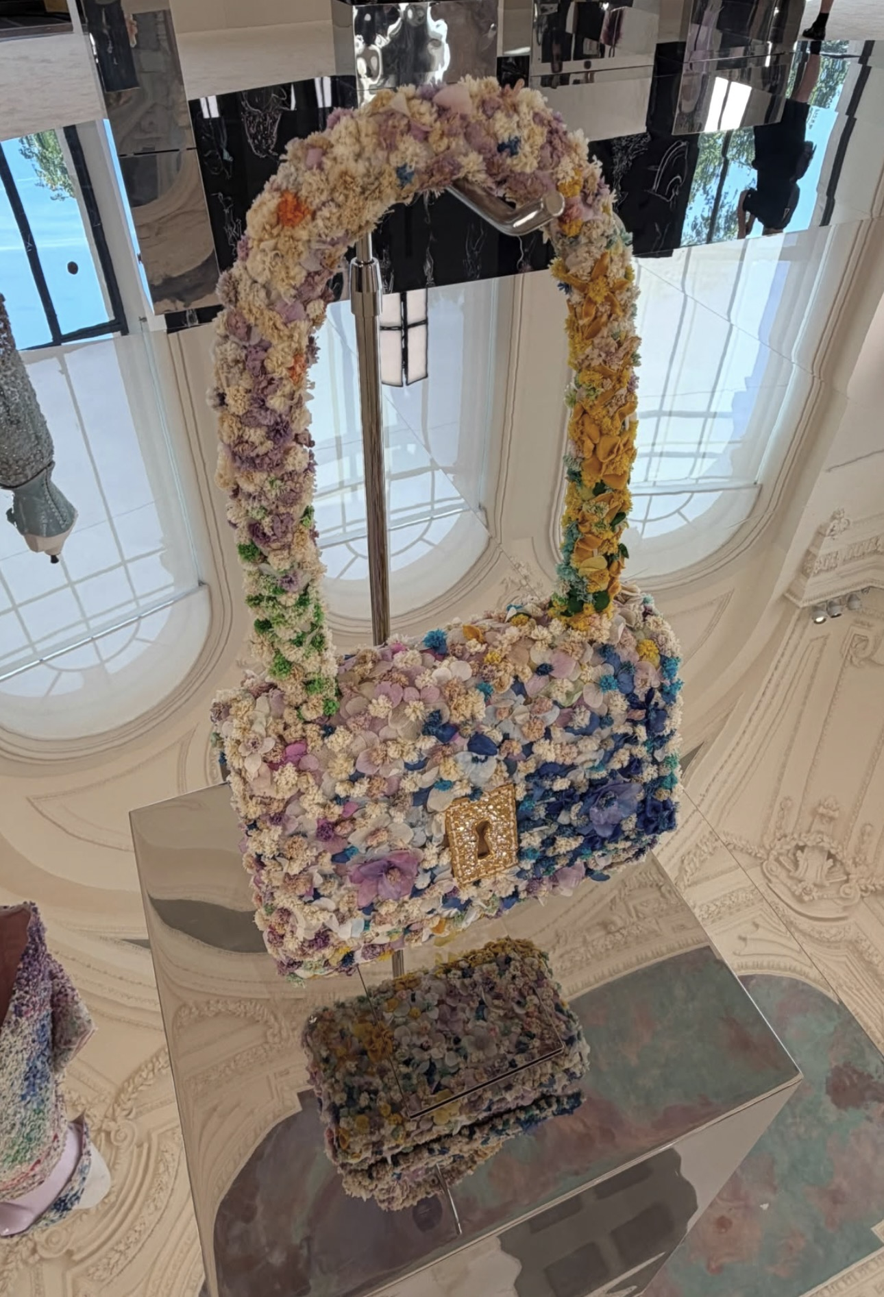 Schiaparelli floral couture handbag displayed during the Maison’s Fall Winter 2026–2027 private presentation in Paris