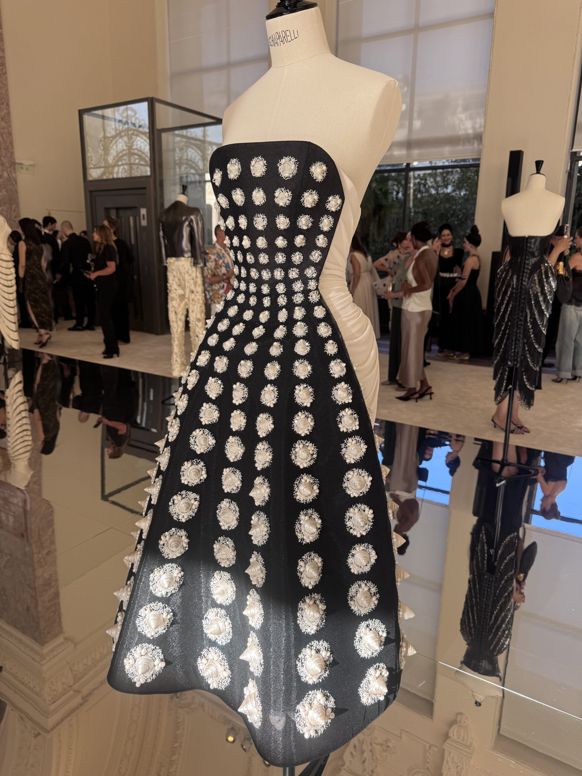 Schiaparelli couture dress featuring dimensional seashell embellishments at the Fall Winter 2026–2027 presentation