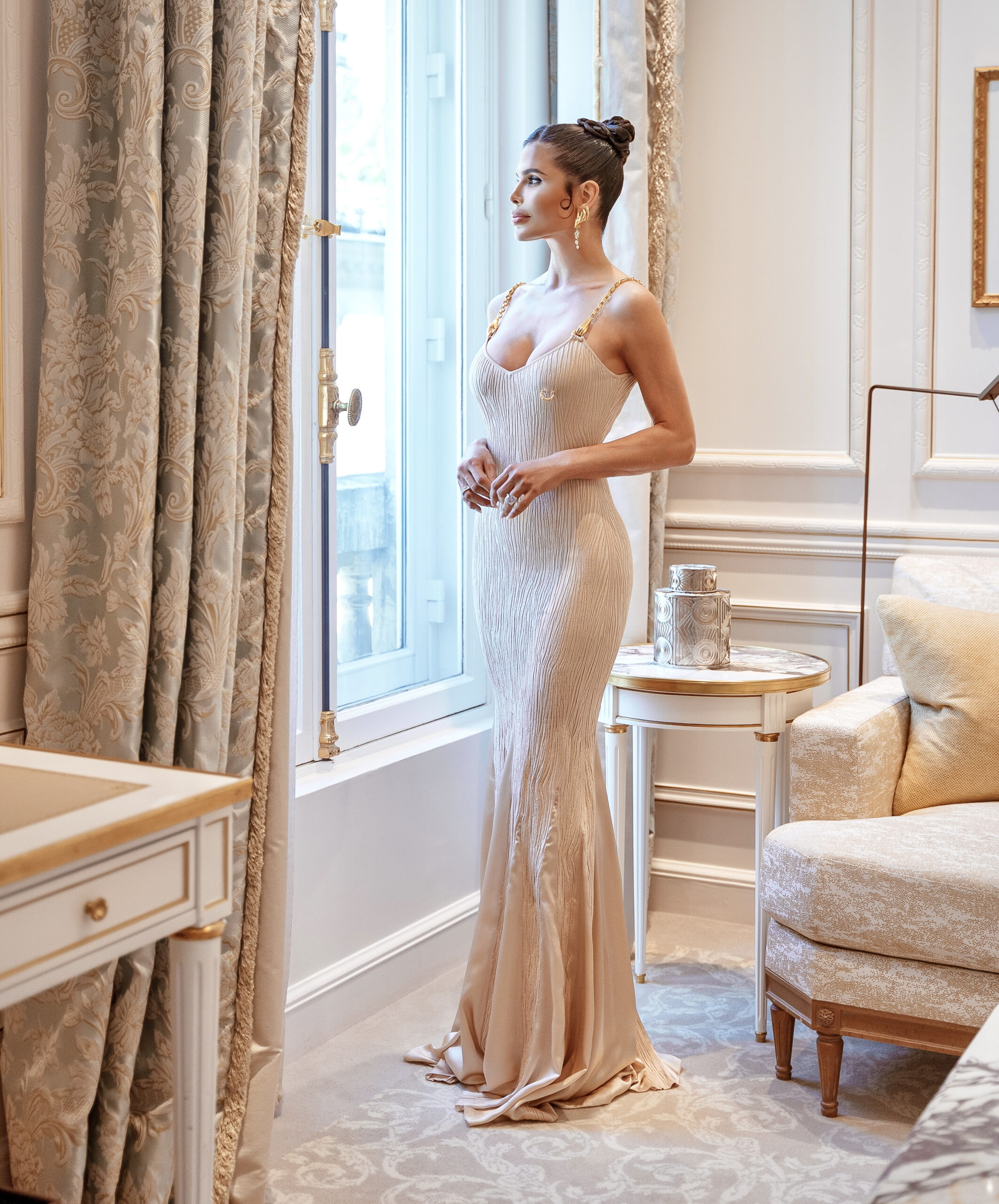 Victoria Barbara wearing Schiaparelli at Le Meurice overlooking Paris before attending the Schiaparelli presentation.